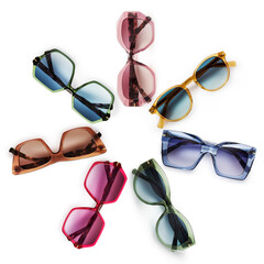 Sunglasses composition in many bright colors in transparent plastic. Top view with shadow. Trendy...