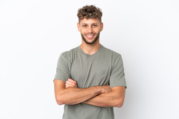 Obraz premium Young caucasian handsome man isolated on white background keeping the arms crossed in frontal position