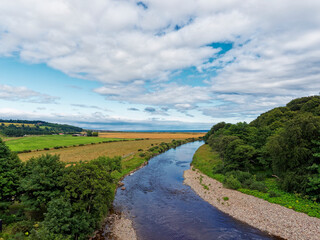 Looking East over Kinnaber Links with the River North Esk flowing towards St Cyrus beach and the North Sea in the distance.
