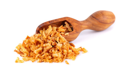 Roasted onions in wooden scoop, isolated on white background. Crispy fried onions.
