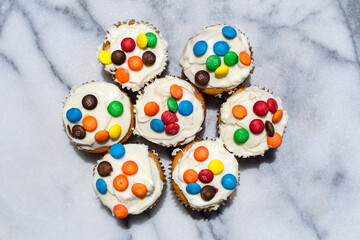 Vanilla Cupcakes with rainbow candies 