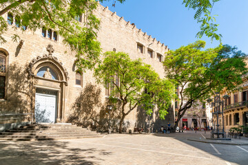The Sant Pere de les Puelles Catholic church in the Plaza de San Pedro, or Placa Sant Pere, in the El Born Gothic quarter of Barcelona, Spain. - obrazy, fototapety, plakaty