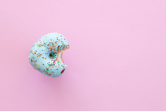 Close Up Donut With Bite Missing Isolated On White Background