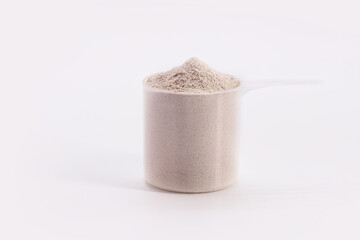 Creatine, food supplement to strengthen muscle fibers, provide energy to the muscles. White background with copyspace
