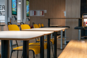Modern and stylish coffee shop design. The interior of the restaurant with tables and chairs and a copy space.