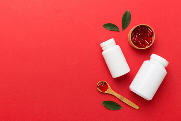 different drugs and health supplement pills with medicine bottle health care and medical top view. Vitamin tablets. Bottle with colored pills on table background. Multivitamins