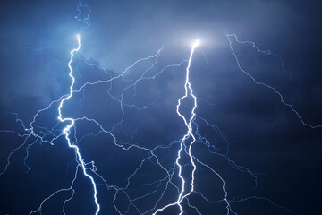 Fork lightning striking down during summer storm	