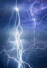 Fork lightning striking down during summer storm	