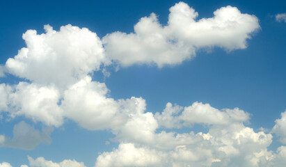 Naklejka na ściany i meble White clouds and blue sky on a sunny summer day