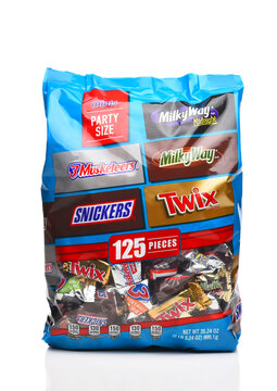 IRVINE, CALIFORNIA - 8 AUG 2022: A Party Size bag of  Minis from, Mars Wrigley Confectionary, including, Twix, Milky Way, Snickers and 3 Musketeers Candy Bars.