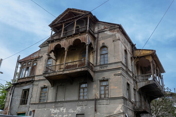 Fototapeta na wymiar A dilapidated abandoned house with an attic in Old Tbilisi, Georgia
