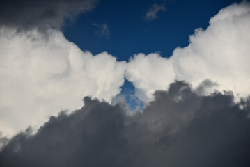 Obraz premium Clouds seemingly kissing each other above the Guaporé river valley and the Amazon rainforest, near the small town of Cabixi, Rondonia state, Brazil, on the border with Santa Cruz Department, Bolivia