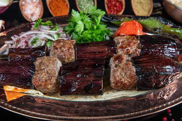 Traditional Turkish kebabs. Eggplant kebab, Adana kebab. With tomatoes, peppers, garlic, bulgur...