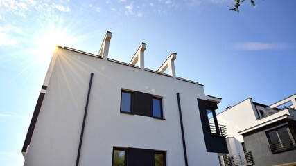 Terraced family home in newly developed housing estate. The real estate market in the suburbs.