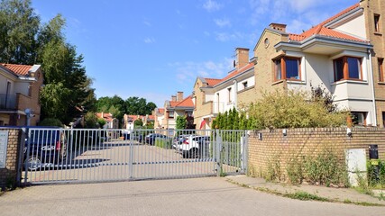 . Driveway and  entrance of an upscale gated community housing estate 