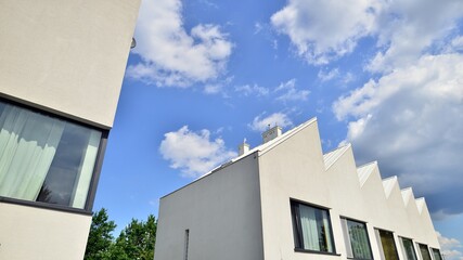 Modern geometric housing architecture. Sunlight  on surface of apartment building, architecture design concept.