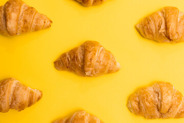 Croissants Patterned On Yellow Surface