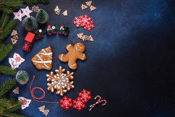 Christmas homemade gingerbread cookies on a dark concrete table table