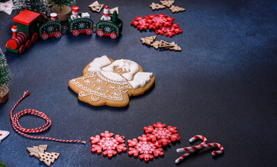 Christmas homemade gingerbread cookies on a dark concrete table table