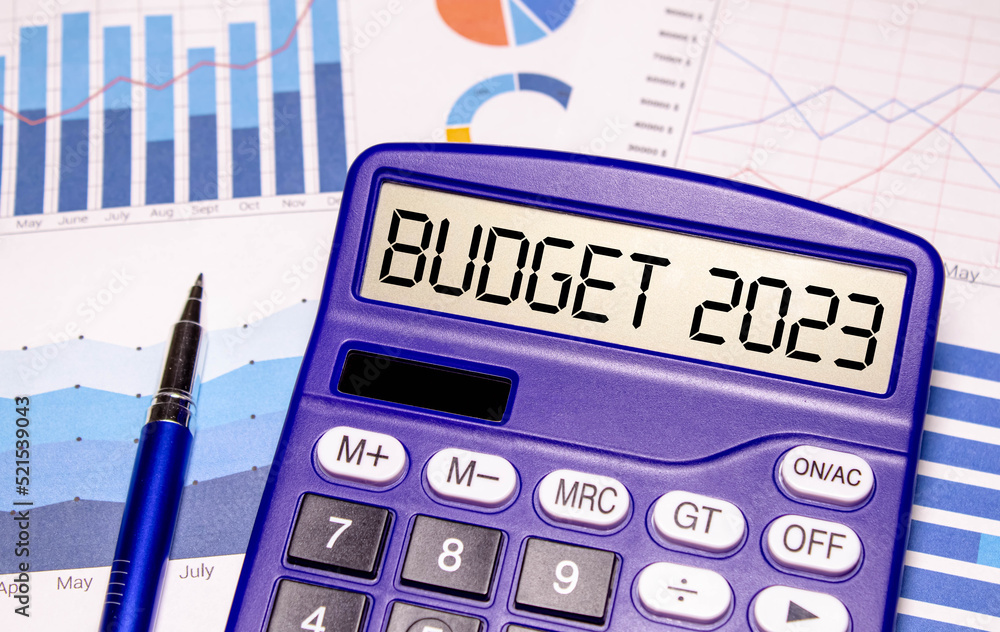 Poster tablet with a sheet of paper with the text budget 2023 on the desktop.