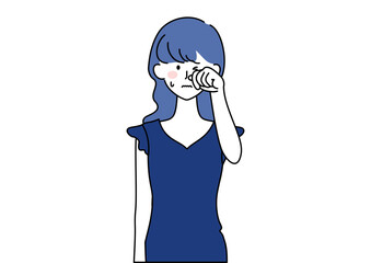 目をこする女性