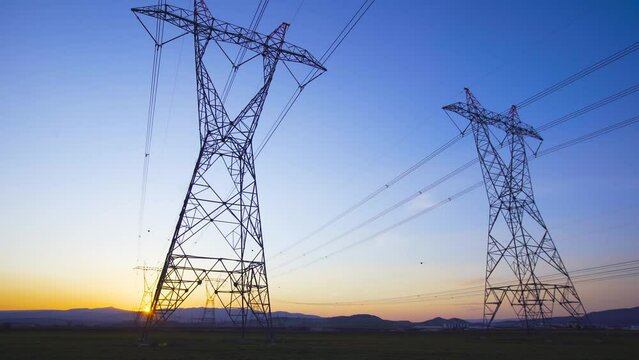 Power lines at sunset.
Landscape of high voltage power lines at sunset.
