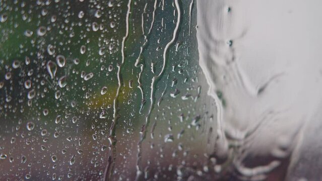 Raindrops Slide Down The Glass