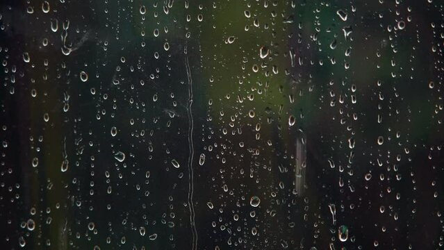 Raindrops Slide Down The Glass