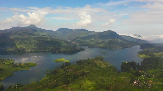Aerial drone of lake among tea estate in the mountains. Tea plantations. Sri Pada, Maskeliya, Sri Lanka.