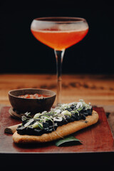 patacón with ahogado and mezcal cocktail
