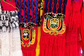 Scarves or makans from Ecuador at the market made using a technique called ikat and knitting....