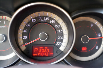 selective focus of a car dashboard details set of a parking vehicle and engine is turned on,...