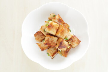 Chinese food, radish cake and XO sauce stir fried with spring onion 