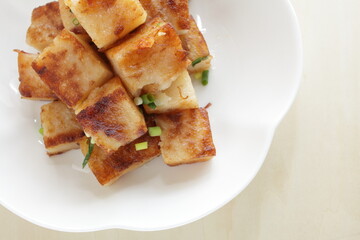 Chinese food, radish cake and XO sauce stir fried with spring onion 