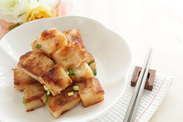 Chinese food, radish cake and XO sauce stir fried with spring onion 