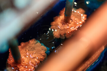 Metal cathodes covered with overgrowth copper powder - obrazy, fototapety, plakaty