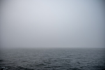 Foggy ocean view with limited visibility.