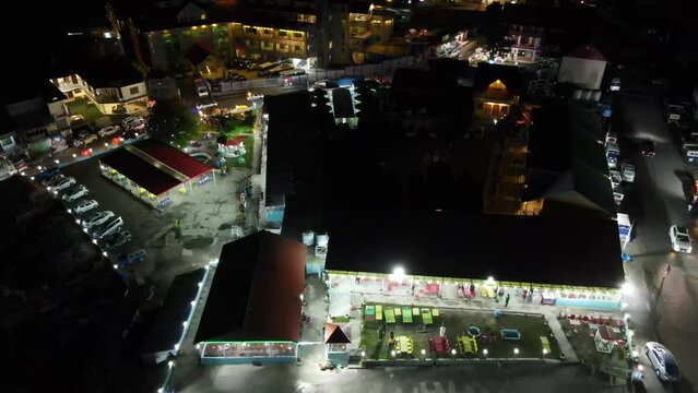 A drone flying over a tourist market at night, in Naran, KPK. Pakistan