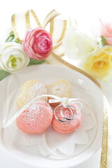 French confectionery, heart shaped Macaroon and wedding rings for marriage image