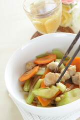 Chinese food, chicken and carrot stir fried with celery