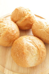 Multiple French bread on wooden board for breakfast image