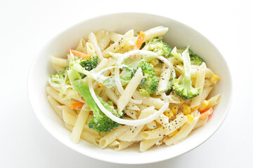 Homemade short pasta and broccoli salad with onion and carrot
