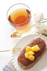 Homemade mango and tea leaves cake on white dish