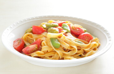 Homemade broad beans and tomato sauce fettuccine pasta