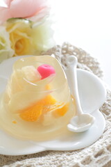 Mixed fruit Jelly on white dish with spoon for dessert image