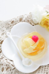 Mixed fruit Jelly on white dish with spoon for dessert image