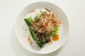 Japanese food, Katsuobushi and soy sauce on boiled spinach for comfort food image