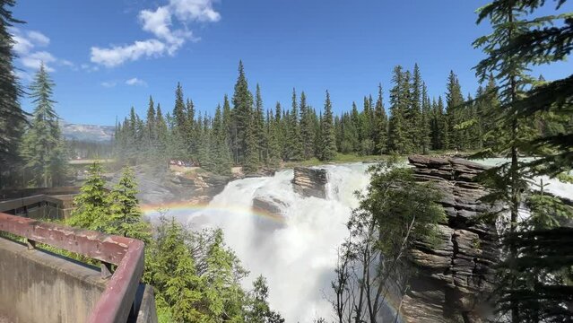 Majestic Athabasca Falls cascading down the rocky cliffs of Jasper National Park, Alberta, Canada. Beautiful view of Athabasca Falls and the powerful waters rushing through its narrow gorge