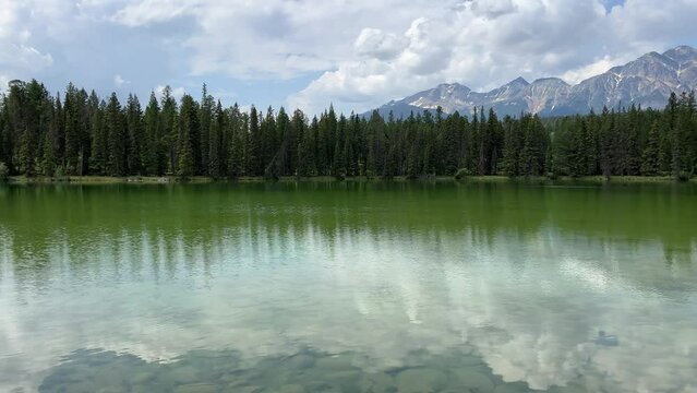 Trefoil lake in Jasper National Park, Canada. A calm and quiet scene featuring the tranquil waters of trefoil lake.
