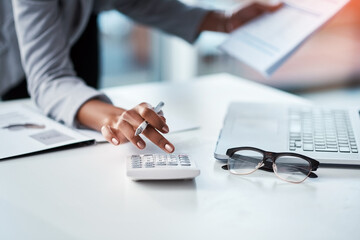 Accountant, businesswoman or banker using calculator, checking paperwork and documents while preparing financial data report in an office. Hands of a woman doing payroll or calculating annual tax - obrazy, fototapety, plakaty